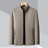 Minimalist dark blue men's bomber jacket featuring a lightweight design, with long sleeves and a collar, suitable for urban fashion.