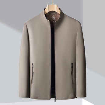 Minimalist dark blue men's bomber jacket featuring a lightweight design, with long sleeves and a collar, suitable for urban fashion.