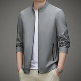 Men's light gray bomber jacket in a minimalist design, featuring a lightweight fabric suitable for urban fashion. The jacket has a collar, long sleeves, and pairs well with a dress shirt or sportswear. It is shown in size 3XL.