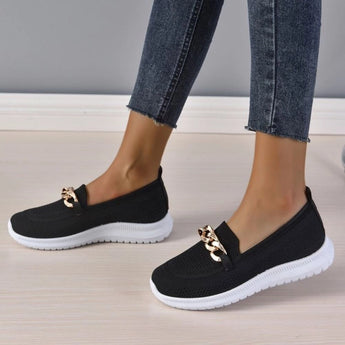 Minimalist white sneaker with a seamless design featuring a lightweight sole, shown in the Nero1 / 422 variant. The shoe is primarily white with subtle black and grey accents, suitable for fashion-forward sportswear and casual denim outfits.