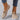 Minimalist white sneaker featuring a seamless design and lightweight sole, displayed in a beige color variant, size 42.