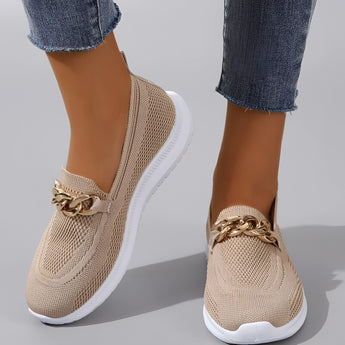 Minimalist white sneaker featuring a seamless design and lightweight sole, displayed in a beige color variant, size 42.