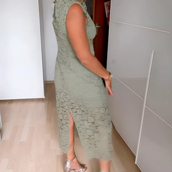 Mint green floral lace sheath dress with elegant detailing, featuring a form-fitting silhouette and designed as a sophisticated option for a wedding guest.