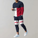 Modern men's streetwear outfit featuring a geometric shirt and joggers in bold purple and black colors, paired with marine blue and red accents, displayed on a model showcasing the ensemble.
