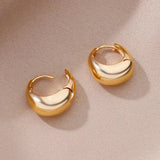 Modern two-tone gold hoop earrings for women, featuring an elegant circular design with a gold-tone finish.