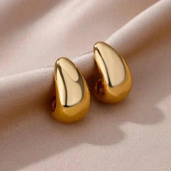 Modern two-tone gold hoop earrings for women, showcasing elegant craftsmanship and a polished finish.