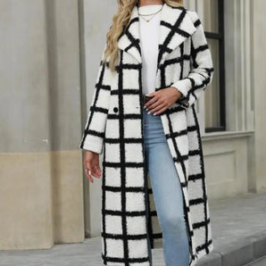 
A stylish monochrome luxury wool plaid oversized winter coat for women featuring a classic overcoat design with a prominent collar and long sleeves.