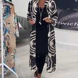 A stylish monochrome tie-dye geometric kaftan dress designed as luxury beachwear, featuring flowing sleeves and a loose fit for a comfortable yet fashionable look.