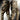 Military personnel wearing multi-camouflage tactical uniform featuring durable, breathable fabric with quick-access gear including cargo pants and outerwear.