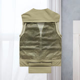 Lightweight, breathable multi-pocket tactical mesh vest in grey, designed for outdoor use, displayed on a clothes hanger.