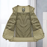 Lightweight, breathable tactical mesh vest in grey, featuring multiple pockets, displayed on a clothes hanger with a dress shirt underneath.