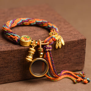 Multicolor Boho Braided Bracelet with Ethnic Charm, Adjustable Tassel, and "Om Mani Padme Hum" inscription, suitable for wrist circumference 14-22cm.