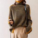 Women's multicolor chunky knit turtleneck sweater made from a wool blend, featuring long sleeves and a thick, cozy collar suitable for winter wear.