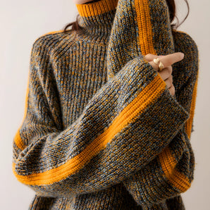 Multicolor chunky knit wool blend turtleneck sweater for women featuring a cozy turtleneck collar, long sleeves, and a stylish plaid design in grey tones.