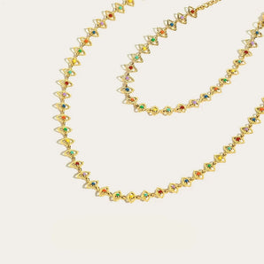 A luxurious multicolor gemstone necklace with 18K gold plating, featuring a symmetrical and artistic design, perfect as a fashionable body jewelry accessory.