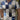 Multicolor patchwork polo shirt for men featuring a vibrant mix of tartan patterns in gray and blue, styled for summer fashion.