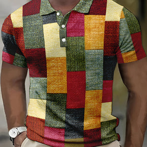 Men's multicolor patchwork polo shirt with a red, yellow, and grey tartan pattern, featuring short sleeves and a collar, in size 3XL.