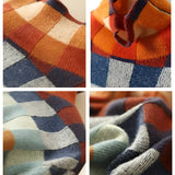 Multicolor plaid women's turtleneck sweater featuring an orange, grey, and multicolored tartan pattern, long sleeves, and a cozy knit fabric perfect for autumn.