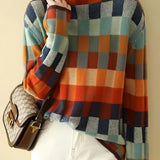 Multicolor plaid women's turtleneck sweater with cozy autumn knit design, featuring long sleeves and a high neckline.