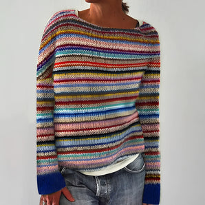 
Women's handknit wool sweater featuring multicolor stripes in a rainbow pattern, with long sleeves and a round collar, showcased in a 2XL size.