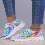 Multicolor women's breathable lightweight athletic sneakers featuring a blend of white, azure, aqua, and violet colors, showcased on a human foot with a focus on fashion-forward textile design.