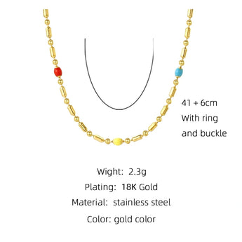A multicolored gemstone necklace with intricate bead designs, set in gold, displayed on a white background.