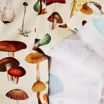 Mushroom Print Pajama Set featuring a botanical nature-inspired design with illustrations of various mushrooms and twigs.