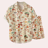 Apricot-colored botanical nature-inspired mushroom print pajama set in size XL, featuring a long-sleeve top with a collar and matching pants.