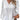 White women's long sleeve blouse featuring lace detail and ruffled accents, shown in a 4XL size.