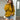 A person wearing a mustard yellow cable knit turtleneck sweater in an XL size, perfect for chunky autumn fashion. The sweater features long sleeves and a cozy turtleneck design. The individual is also wearing sunglasses and is styled in a casual, stylish manner.