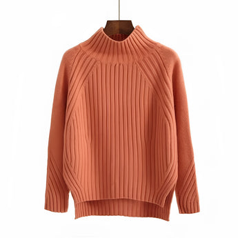 Mustard yellow pleated turtleneck sweater in an orange hue, featuring long sleeves and a cozy knit fabric, suitable for winter wear.