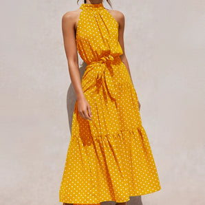 Mustard yellow polka dot tiered midi halter dress in XL, featuring a sleeveless design and fitted waist, displayed on a mannequin against a simple backdrop.