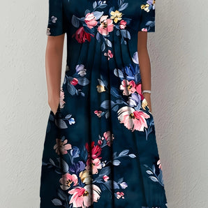 Navy A-Line knee-length floral dress with short sleeves and pockets, displayed on a mannequin with emphasis on the dress's fit and floral pattern.