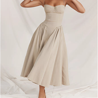 Navy blue fit and flare midi dress with spaghetti straps, designed for summer wear, shown in size XL, featuring a flattering silhouette and elegant neckline.