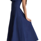 Navy blue floral A-line midi cocktail dress with spaghetti straps, featuring a fitted bodice and flowing skirt.