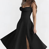 Navy blue floral A-line midi cocktail dress with spaghetti straps, featuring a sleeveless design showing arms and shoulders, suitable for an elegant evening occasion.