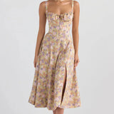 Navy blue floral A-line midi cocktail dress with spaghetti straps, featuring a fitted waist and flowing skirt.