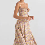 Navy blue floral A-line midi cocktail dress with spaghetti straps, shown on a model.