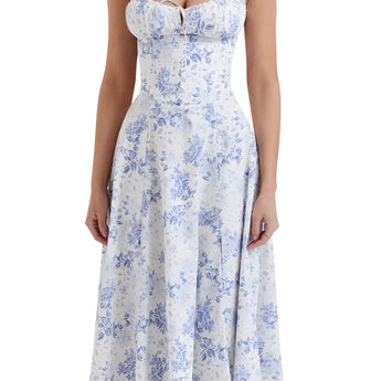 
A navy blue floral A-line midi cocktail dress featuring spaghetti straps, suitable for formal or semi-formal occasions. The dress is modeled in a 2XL size and showcases a fitted waist and flowing skirt.