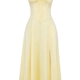 Navy blue floral A-line midi cocktail dress with spaghetti straps, featuring a fitted waist and flowy design, suitable for formal occasions or bridal parties.