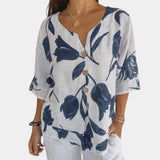 Navy blue floral linen V-neck blouse for women, featuring a casual summer design with short sleeves and floral patterns, styled for a relaxed and comfortable fit.