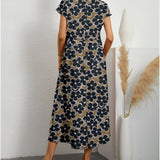 Navy blue floral midi dress with short sleeves, a round neck, and fitted at the waist, designed for casual summer wear.