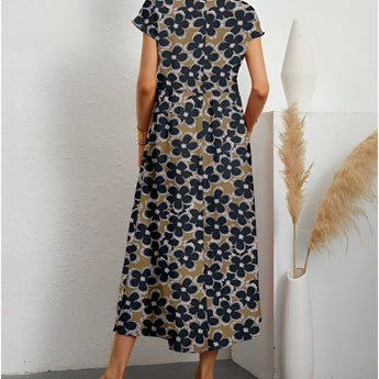 Navy blue floral midi dress with short sleeves, a round neck, and fitted at the waist, designed for casual summer wear.
