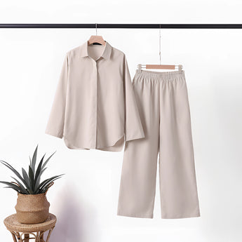 Navy blue linen casual two-piece summer suit for mature women, featuring a beige color in size 5XL, displayed on a clothes hanger against a neutral grey background. The suit has a fashionable design with a focus on the sleeve and collar details.