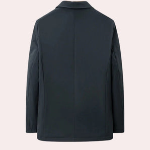 Navy blue men's blazer featuring leather sleeves, a structured collar, and button closures, designed for a modern formal look.