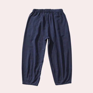 Navy blue men's linen pants with an elastic waist, designed for breathability and eco-friendliness.