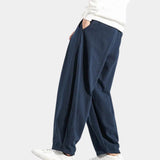 Navy blue men's linen pants with an elastic waist, designed for comfort and breathability. Eco-friendly and suitable for casual or active wear.