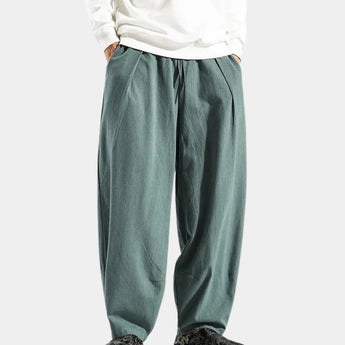 Navy blue men's linen pants with an elastic waist, designed for breathability and eco-friendliness.