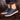 Navy blue men's low-top leather sneakers with a stylish and durable design, suitable for casual wear and walking, displayed against a fashionable background.