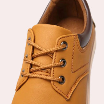 Navy blue men's low-top leather sneakers showcasing a stylish and durable design.